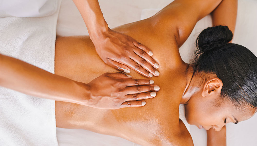 woman enjoying massage in room