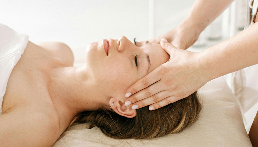 woman getting a facial at a spa