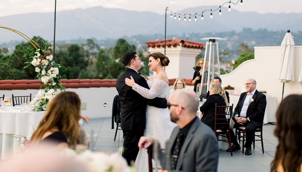 Newlyweds dancing on Canary rooftop