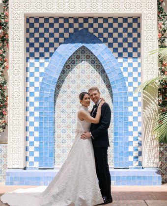 Natali and Colburn at tiled archway