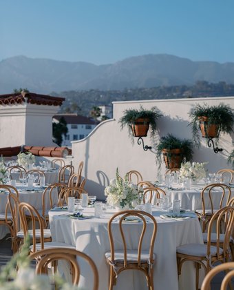 Rooftop reception tables with mountain views